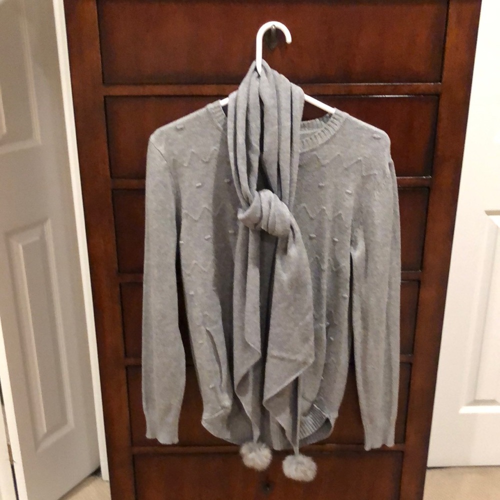 Grey sweater with pockets and scarf to match. Ribbed sleeves and hem.